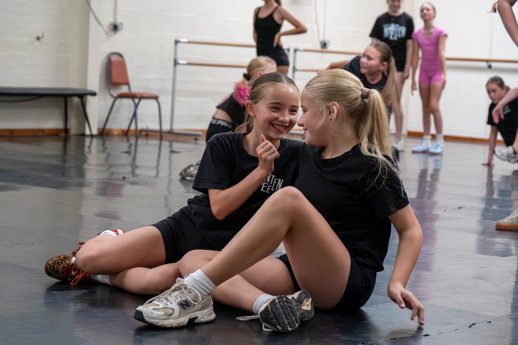 DC-19 dancers laughing together between routines