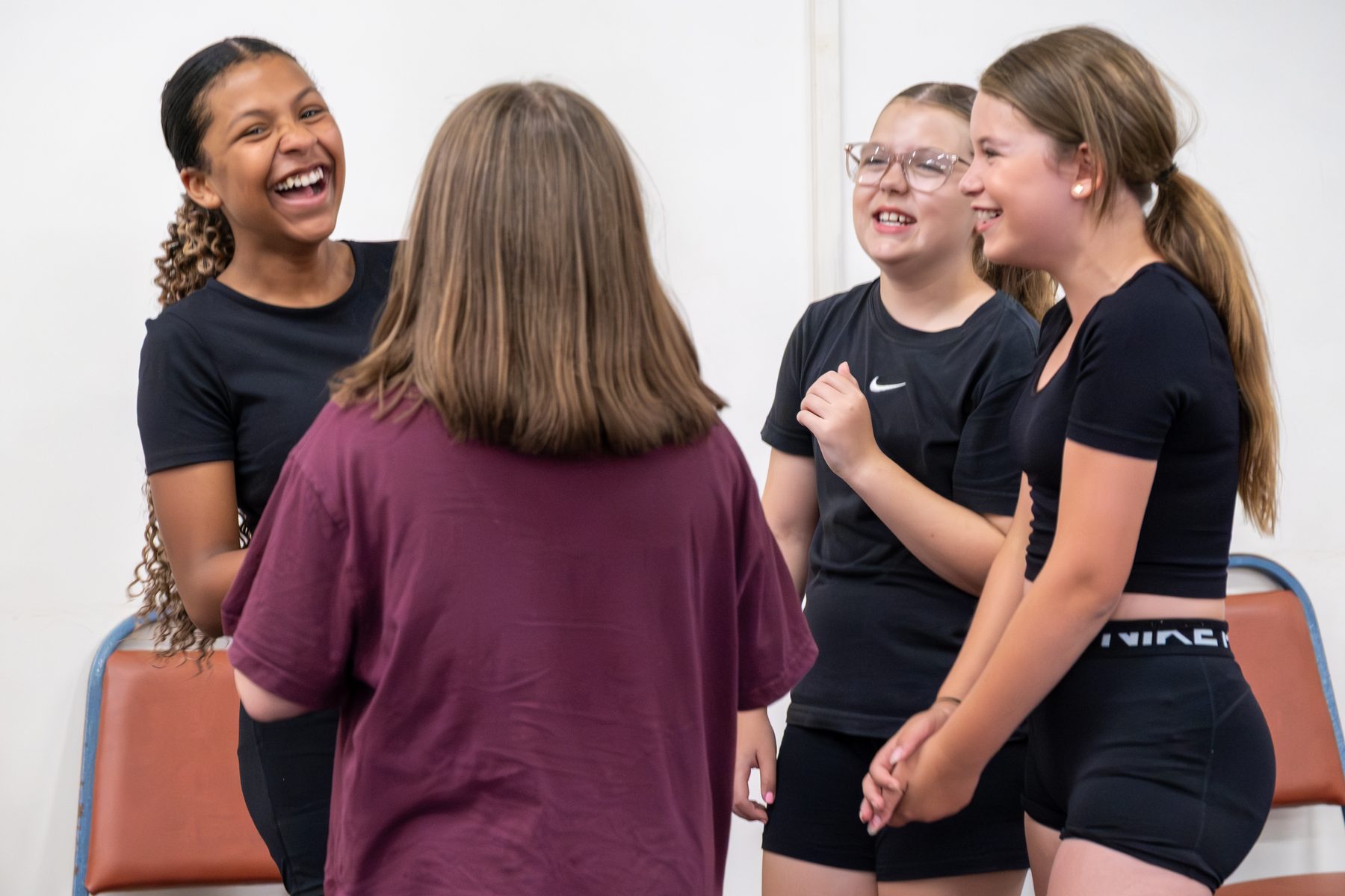 Studio 19 dancers in a group hero-about before class