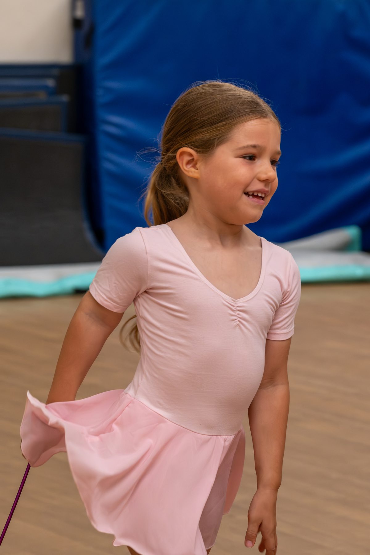 Young ballet dancers with arms raised